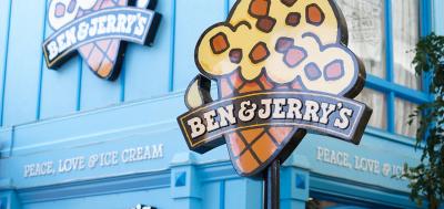 Front of Ben & Jerry's scoop shop with large ice cream cone sign