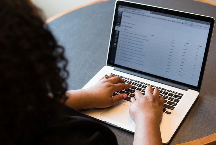 Student working in online classroom on a laptop