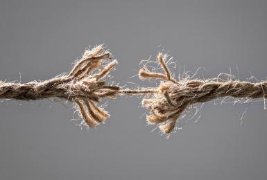 Rope fraying from tension and stress.