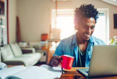 Person on laptop in the comfort of their home