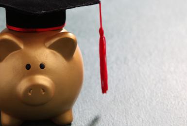Piggy bank wearing a graduation cap 