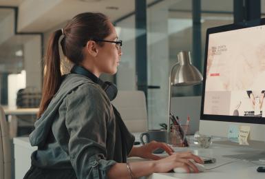 Shot of a young designer working on a computer in an office.