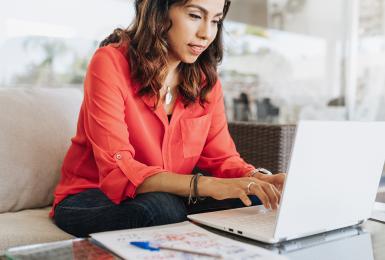 Portrait of mature Latina businesswoman working from home.