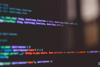 Black screen with colorful data and coding