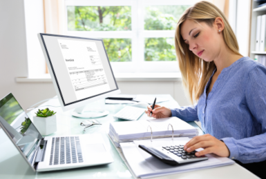 accountant using calculator 