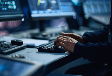 Male hands typing on a keyboard