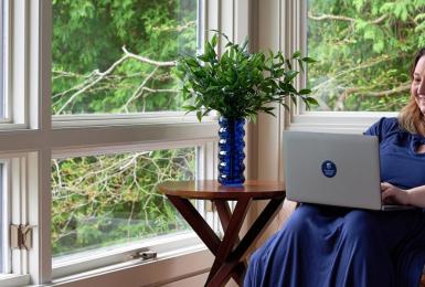 Adult female sitting with laptop