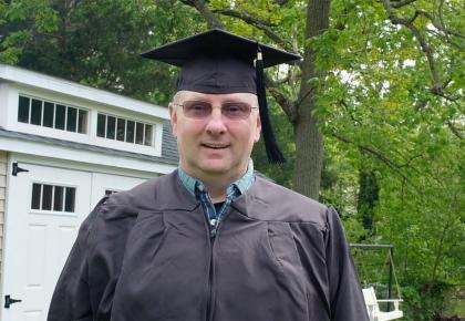 2020 Champlain Graduate in cap and gown