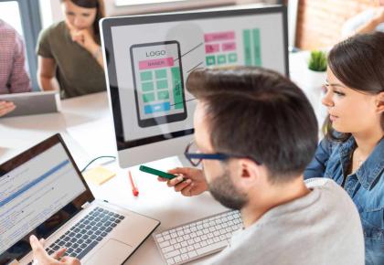 Web designer and developer team working on computers