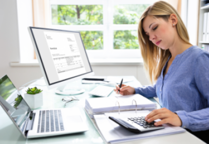 accountant using calculator 