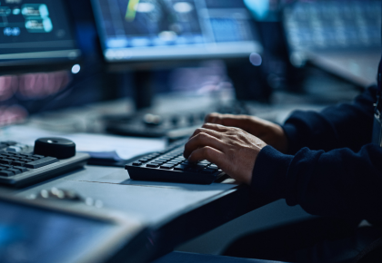 Male hands typing on a keyboard