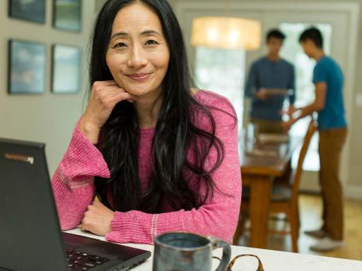 Adult female students on her laptop at home