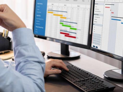 Man using project management workflow tool on a computer