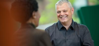 Military students talked and laughing with academic advisor