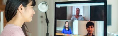 Person at computer having virtual meeting