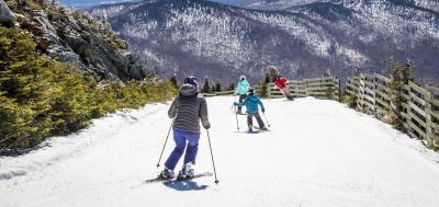 Skiers headed down a ski slope