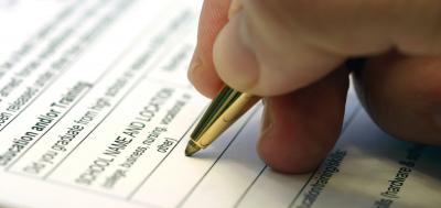 Person filling out a form