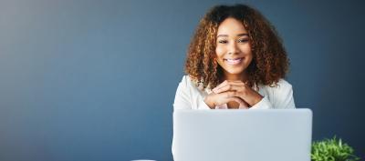 smiling woman at laptop