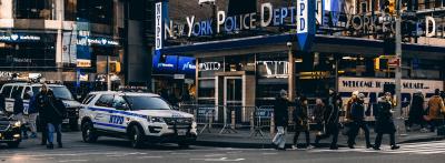 NYPD patrol car in front of times square precinct