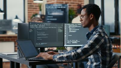 software developer at desk working at computer