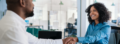 HR professional shaking hands with other person