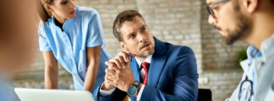 healthcare administrator working with doctor and nurse