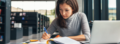 college student taking notes