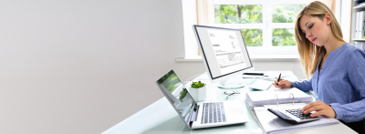 accountant sitting at desk using computer