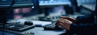 Male hands typing on a keyboard