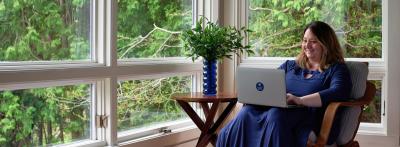 Adult female sitting with laptop