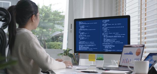 Back rear view of young asian woman, freelance data scientist work remotely at home coding programing on Big data mining, AI data engineering, IT Technician Works on Artificial Intelligence Project.