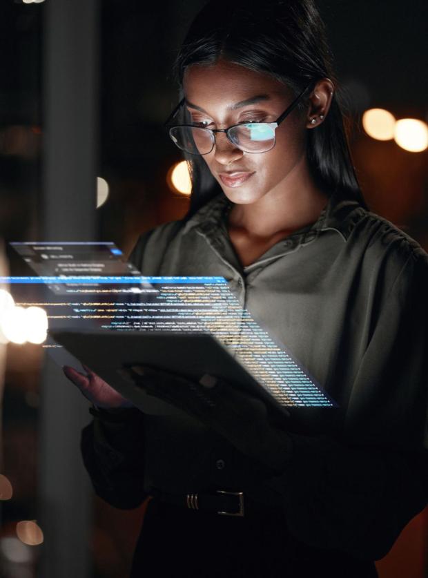 Woman, tablet and hologram at night in web design with dashboard, interface or hud display at the office.