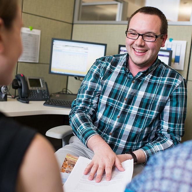 Online human resources graduate certificate student meeting with colleague