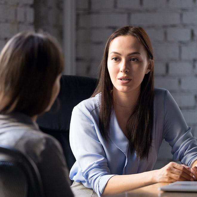 Two women meeting at a table