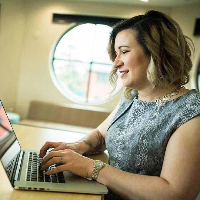 Online project management student on a computer