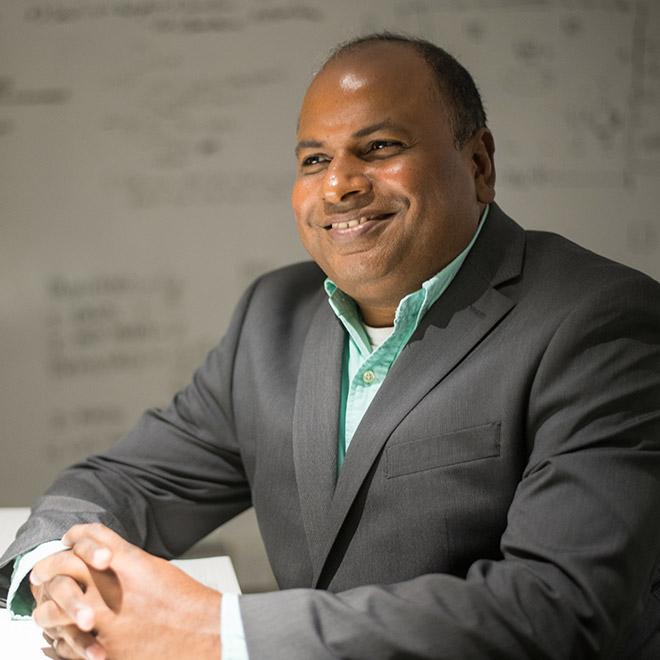 Software Development professional at the office in front of white board