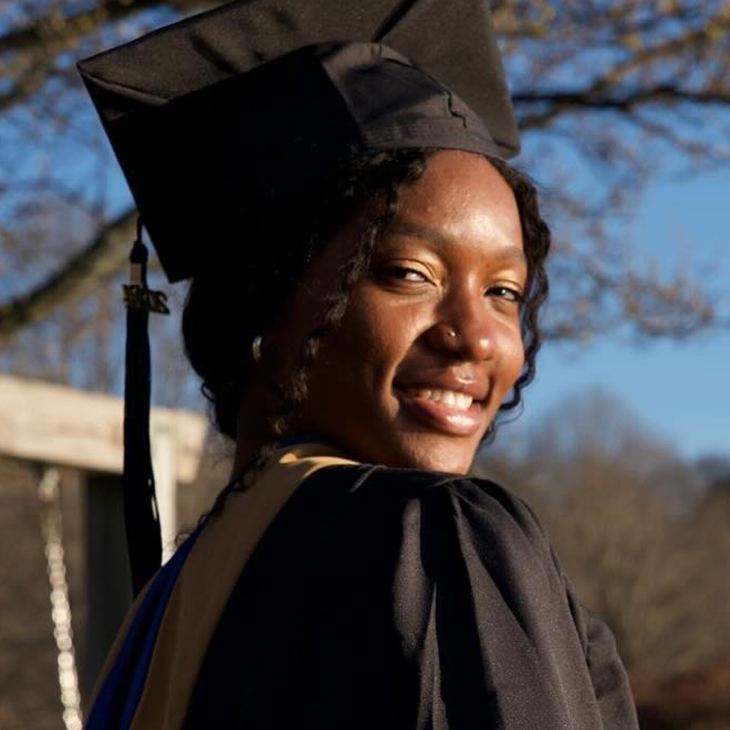 Photo of Jessie Anderson in her cap and gown at commencement